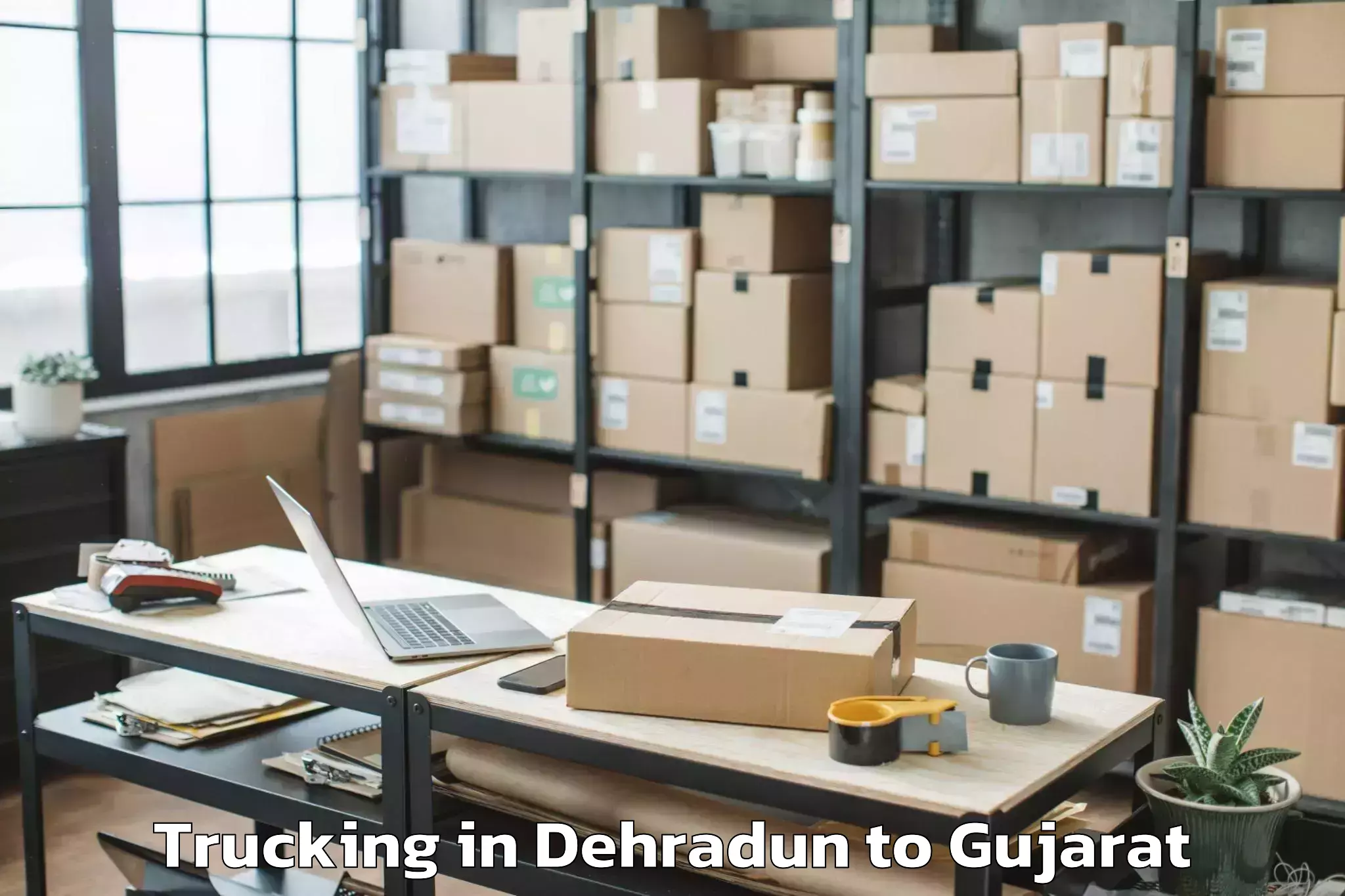 Easy Dehradun to Madhavpur Trucking Booking